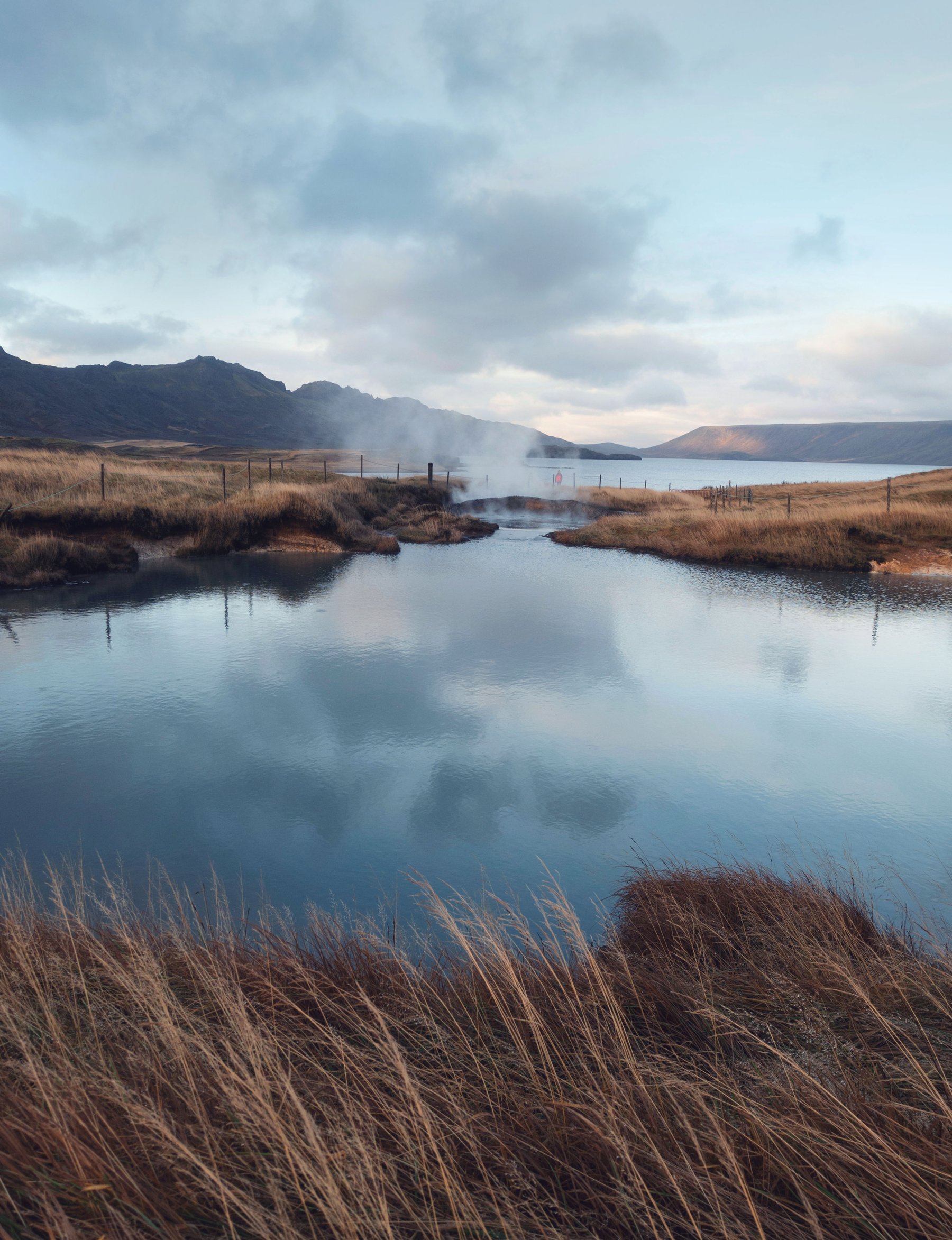 Steaming natural hot springs at dawn